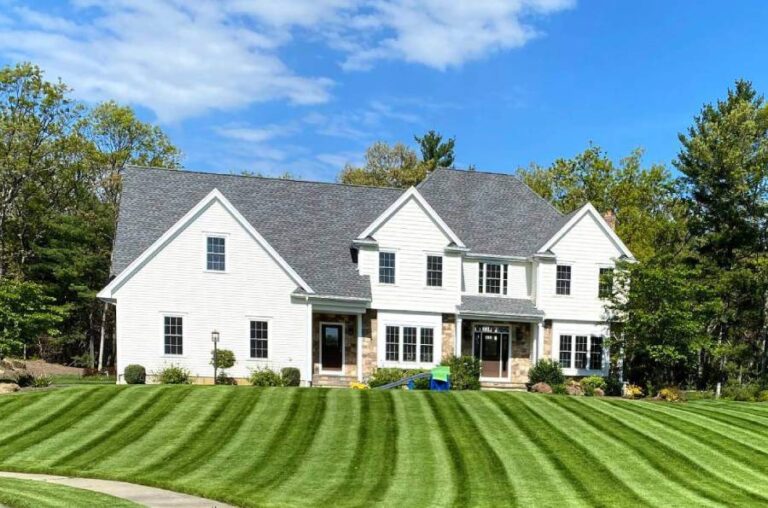 white home with freshly cut lawn