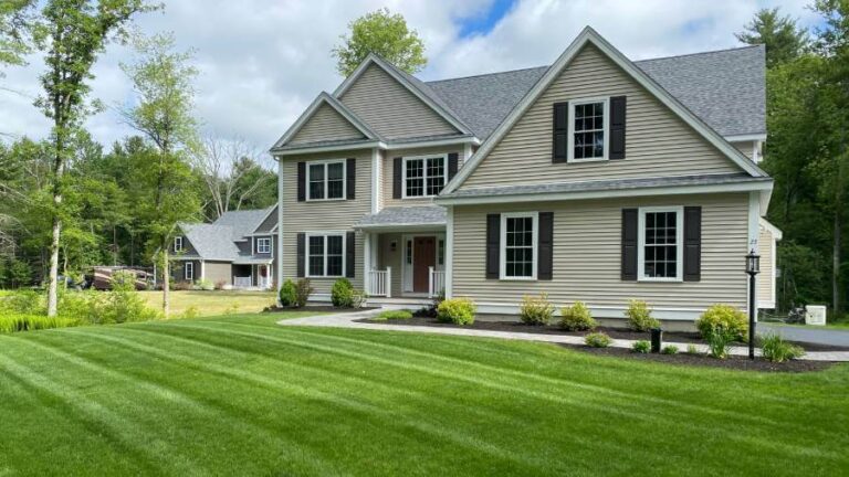 beige home with cut lawn